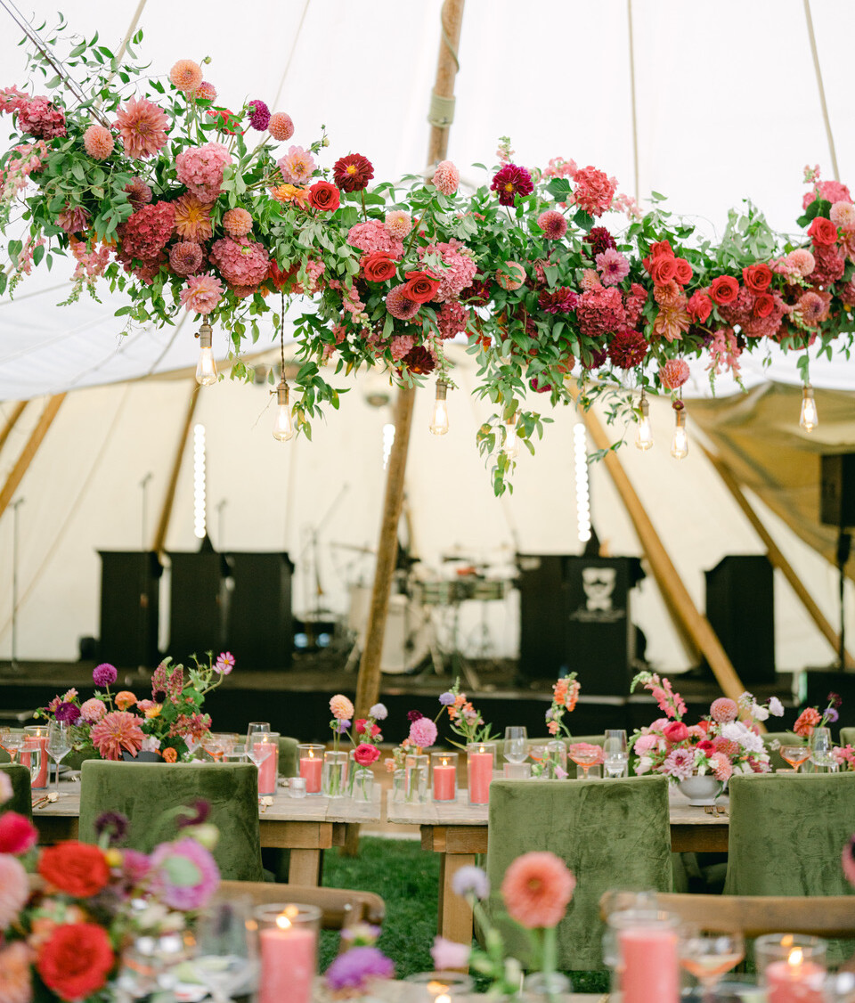outdoor party with pink and red florals